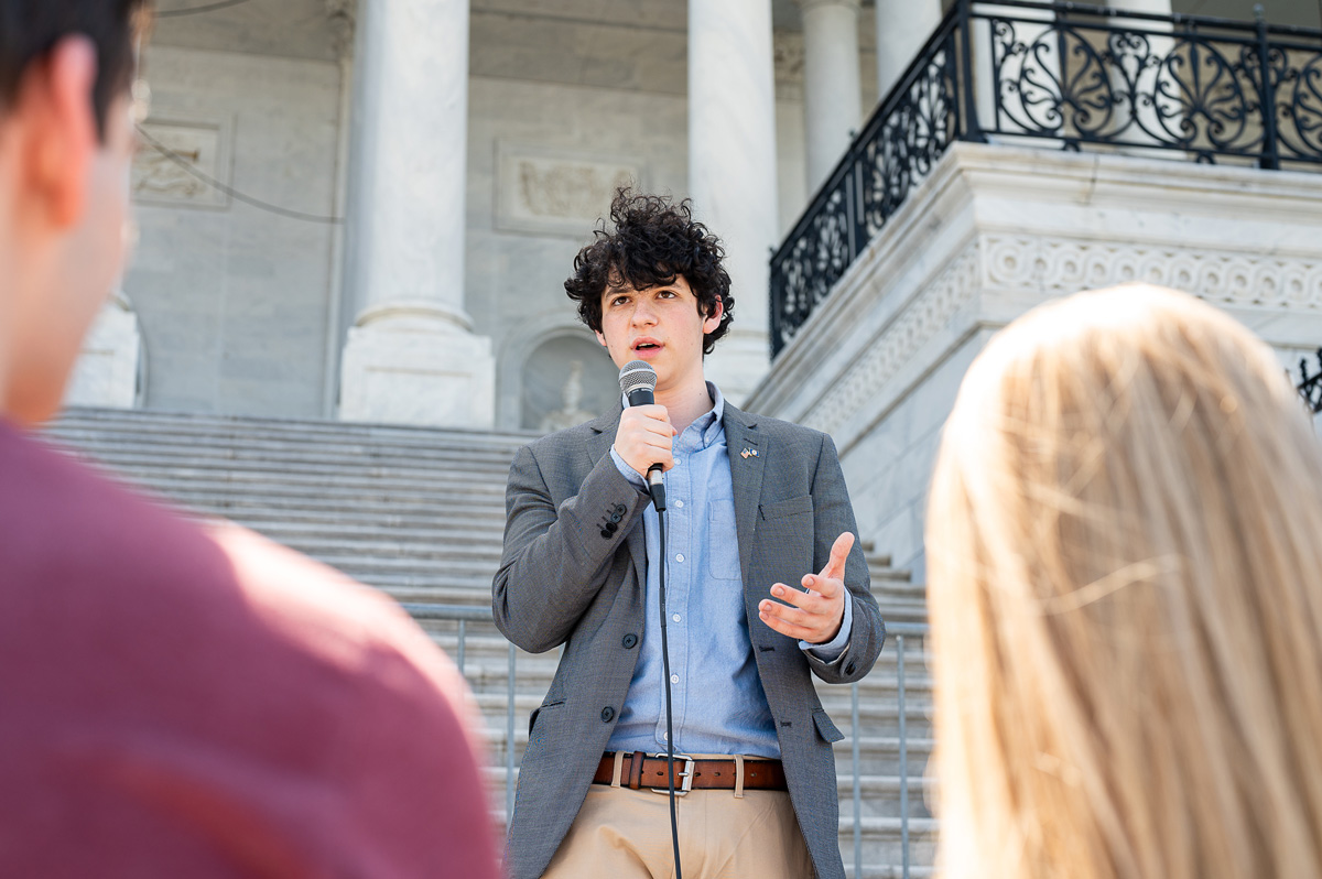 Aaron Zevin-Lopez on steps of Capitol